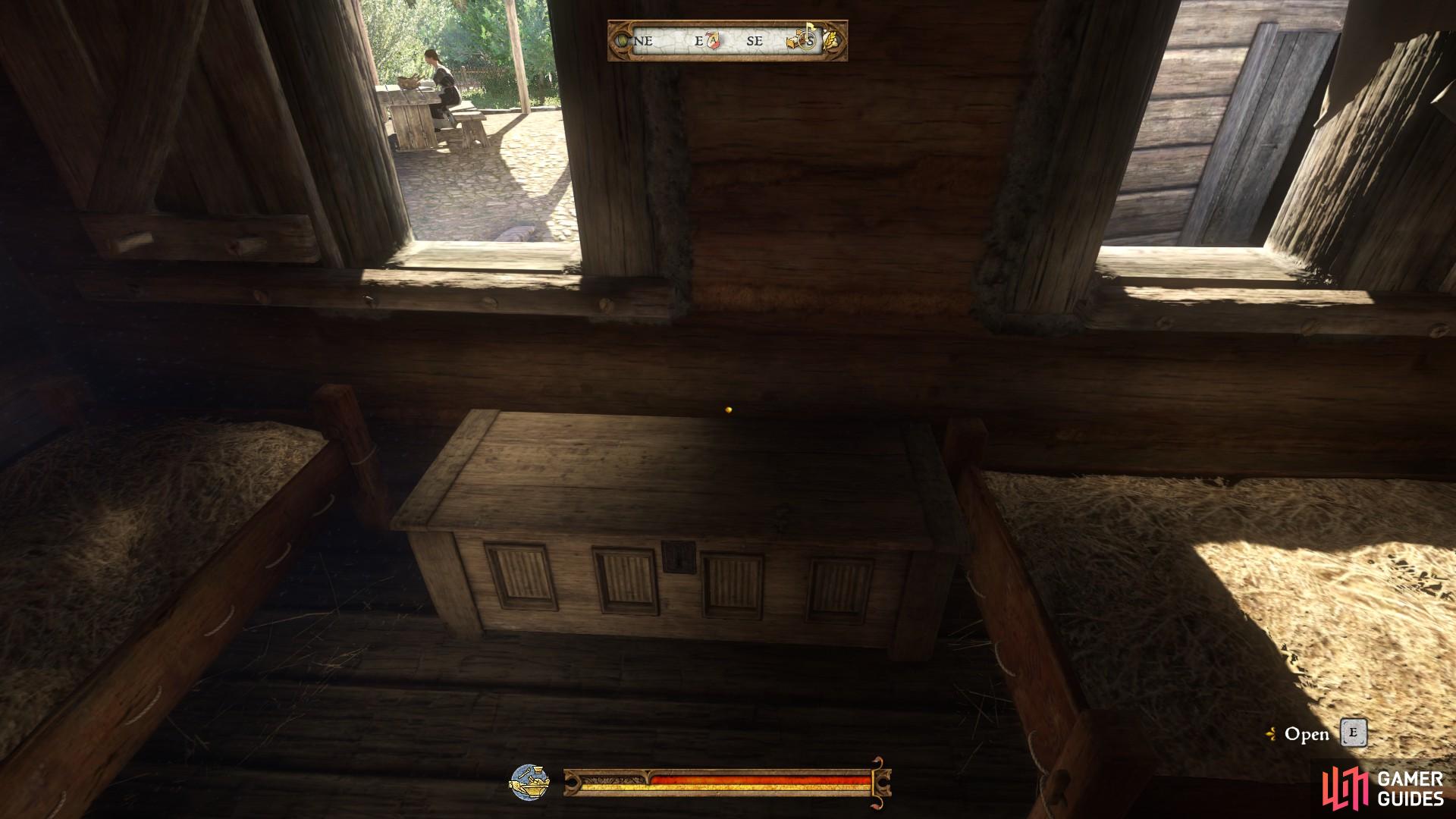 The first home chest available to use is located next to Henry’s bed in Rattay Mill.