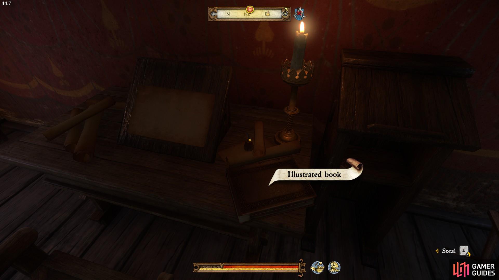 The book is located on the table directly in front of the doorway. 