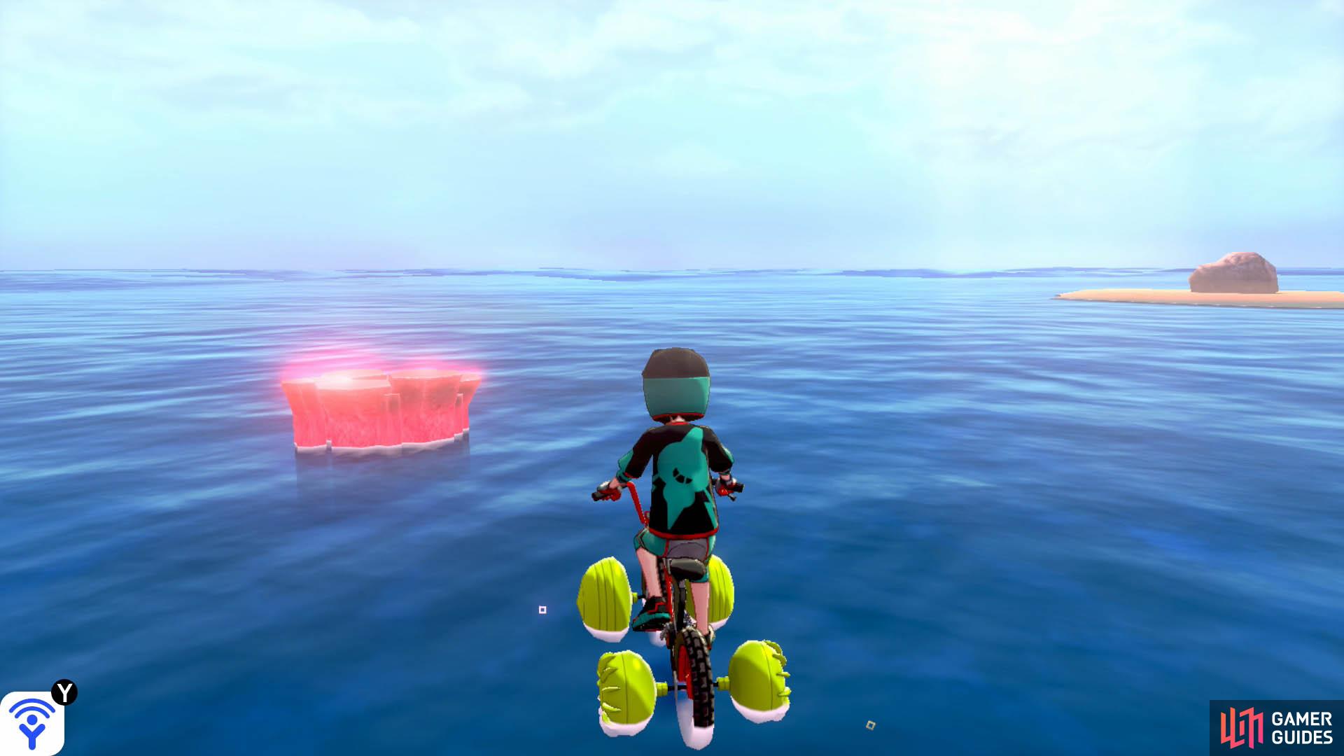 Return to the first islet, directly opposite Armor Station. Straight ahead, in the distance, there should be a den that’s near an islet with a boulder. That’s the den you’re looking for. Expect an incoming Sharpedo.